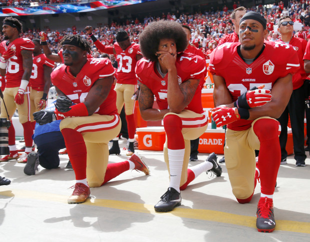 Coline Kaepernick kneeling